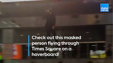 Spectators surprised by man flying through Times Square on a hoverboard