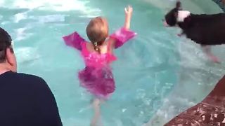 Tot Girl Gets Into A Pool And A Dog Jumps On Top Of Her