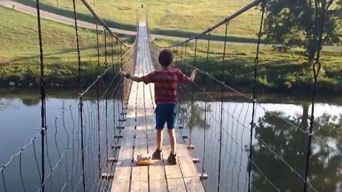 Kid Dancing On A Swinging Bridge !