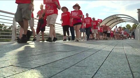 Dozens of people marched along Tampa Riverwalk to bring awareness to gun violence