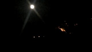 Pusch Ridge mountain fire with full moon