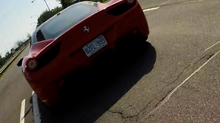 GoPro falls off moving Ferrari on busy highway