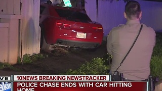 Police chase ends with car driving into a home