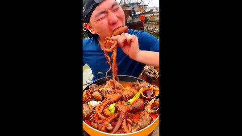Chinese fisherman cooking and Eating fresh seafood...