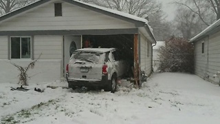 Jeep crashes into home