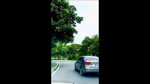 "Exploring Islamabad's Serene Rounded Roads and Lush Greenery"