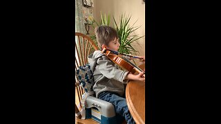 Our 4 year old grandson practicing the violin