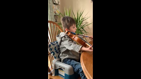 Our 4 year old grandson practicing the violin