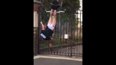 Police Officer Gets Stuck Upside-Down On A Gate