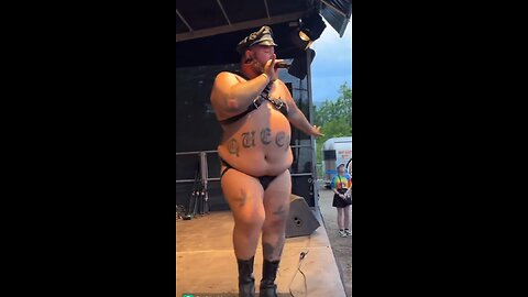 Video captures a overweight man wearing minimal clothing, with a tattoo reading "queer"