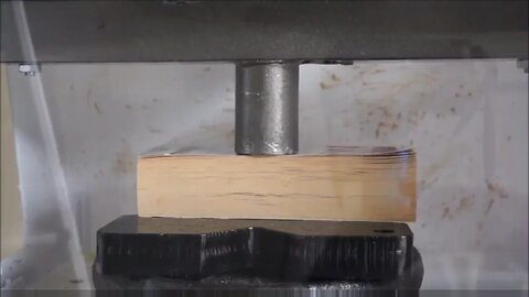Thick Book Crushed By Hydraulic Press