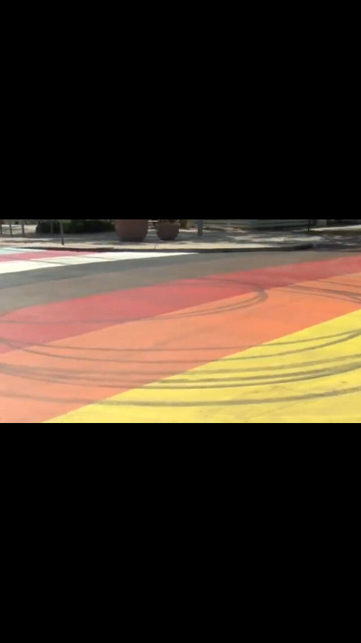 Police Hunt Man Who Did Donuts On a Pride Flag Mural in the Street