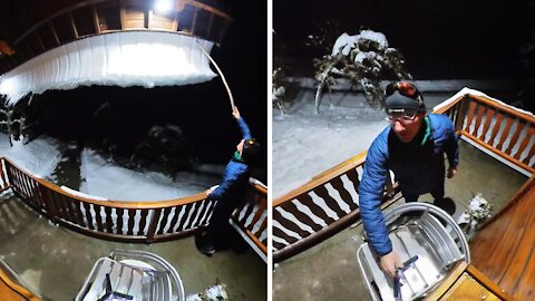 Unbelievable mountain of snow falls off this man's roof
