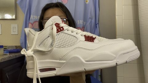 This is a pair FAKE Air Jordan 4 shoes