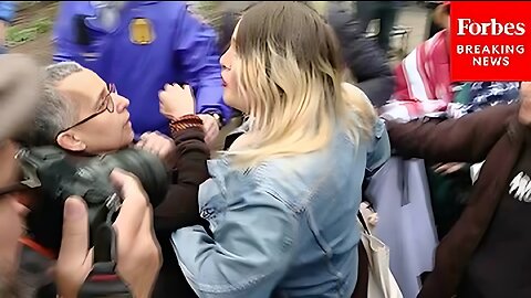 Pro- and anti-Trump protesters nearly collide before the ex-arraignment President's