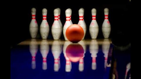 Kid uses a soccer move to get a strike in bowling