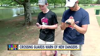 Crossing guards warn kids distracted by phones