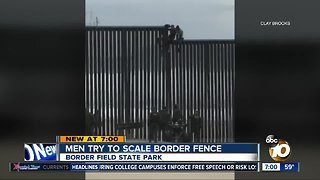 Men try to scale border fence