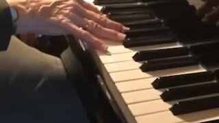 Grandmother plays grandson's requests on piano