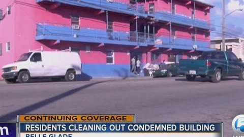 Residents cleaning out condemned building
