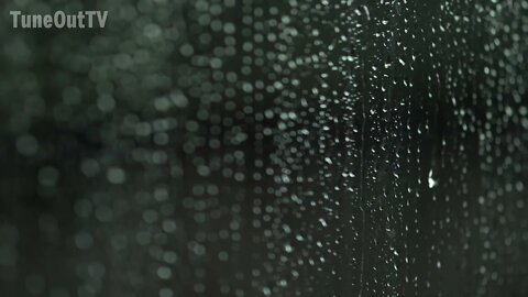 Raindrops dripping from a window on a very rainy day to help that pesky insomnia.