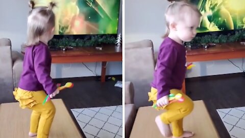 This toddler is most definitely a future metalhead