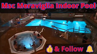 MSC Meraviglia Indoor pool at night with the retractable roof