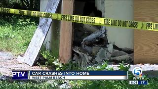 Car drives into home in West Palm Beach