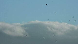 clouds pouring themselves over mountains on April 10, 2022