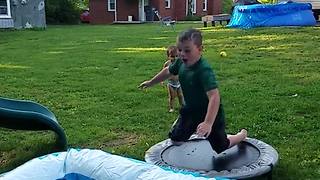 Young Boy Trips And Falls On His Face In A Kiddie Pool
