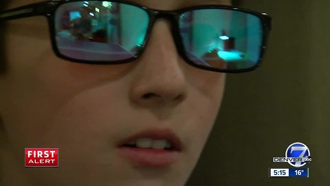 The moment a Colorado boy with color blindness sees color for the first time thanks to his friends