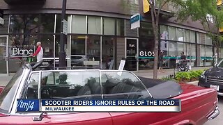 Scooter riders ignore the rules of the road