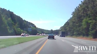 Lady Is Too Busy Filming A Burning Tire On The Truck, Doesn’t See What’s In Front Of Her