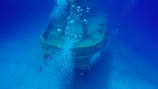 Divers explore Kittiwake shipwreck on Grand Cayman Island