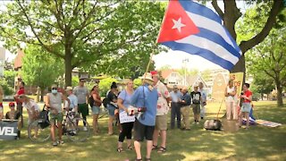 Demonstrators rally at Mitchell Park demanding an end of the Cuban embargo
