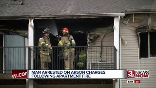 Man arrested on arson charges following apartment fire