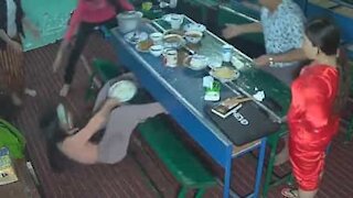 Woman's messy fall while taking pictures of food