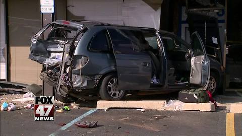 Truck crashes into Michigan bank