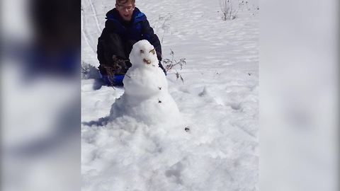 "Boy Crashes Into Snowman Sledding Down a Slope"