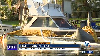 Boat sinks in canal in Palm City