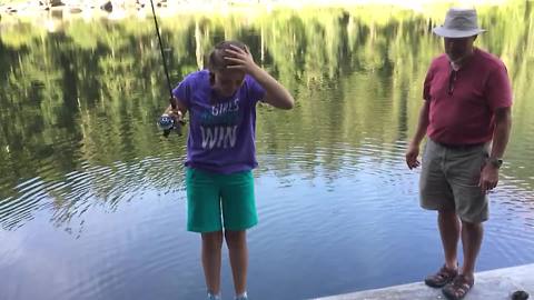 Girl Drops Fish In The Water