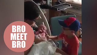 Nervous mom watches her autistic five-year-old meet his baby brother for the first time