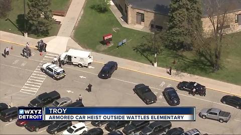 Suspect sought in armored car heist outside Troy elementary school