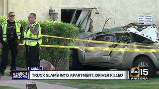 Truck slams into apartment, driver killed