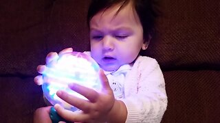 Baby is Amazed About Spinning Light Toy