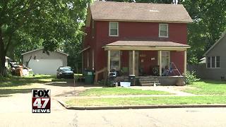 Neighbors concerned about trash piling up outside Mid-Michigan home