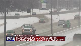 Crews cleaning roads after snow storm