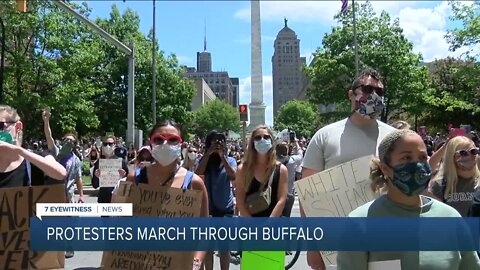 Hundreds of protestors peacefully march through the streets of Buffalo
