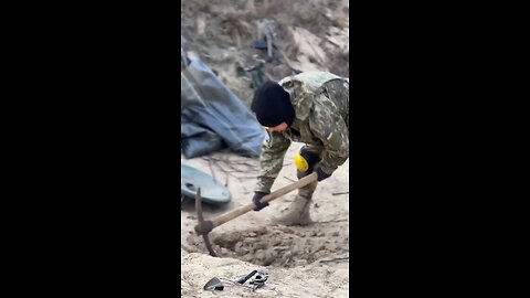 Female Ukrainian soldiers digging trenches near the frontline. “To the last Ukrainian”