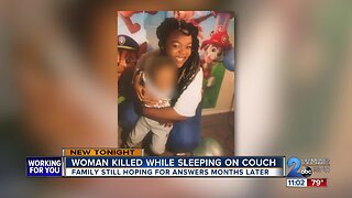 Woman killed while sleeping on couch